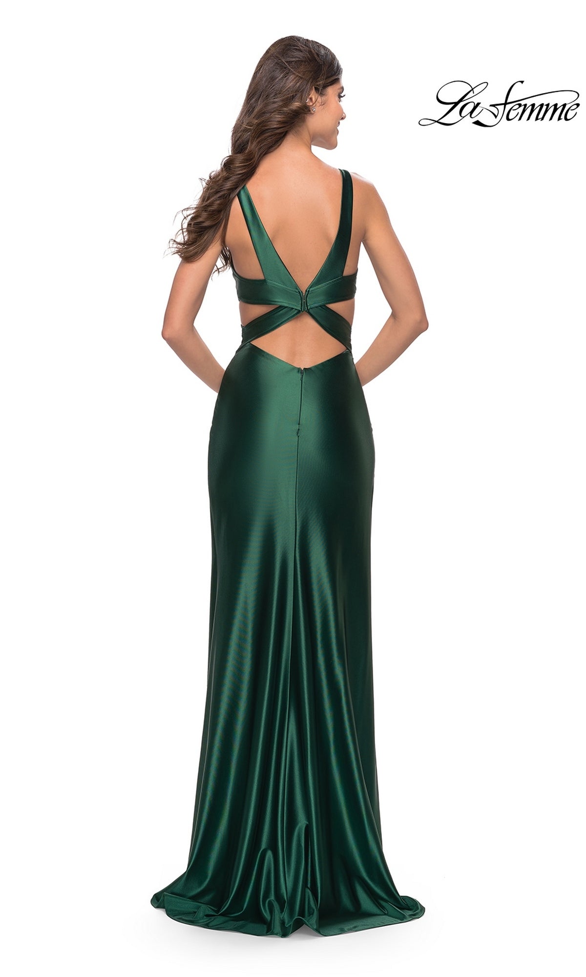 Back view of a floor-length emerald green liquid jersey La Femme 31374 prom dress with a V-neck, open back, and crisscross straps.